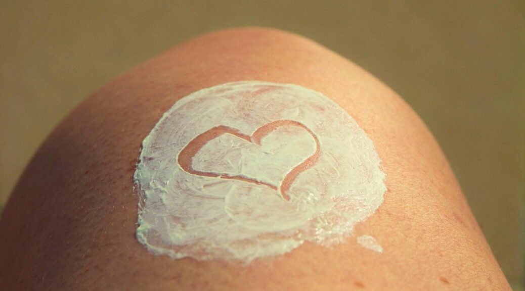 what_is_the_best_skincare_for_aging_skin-heart on knee